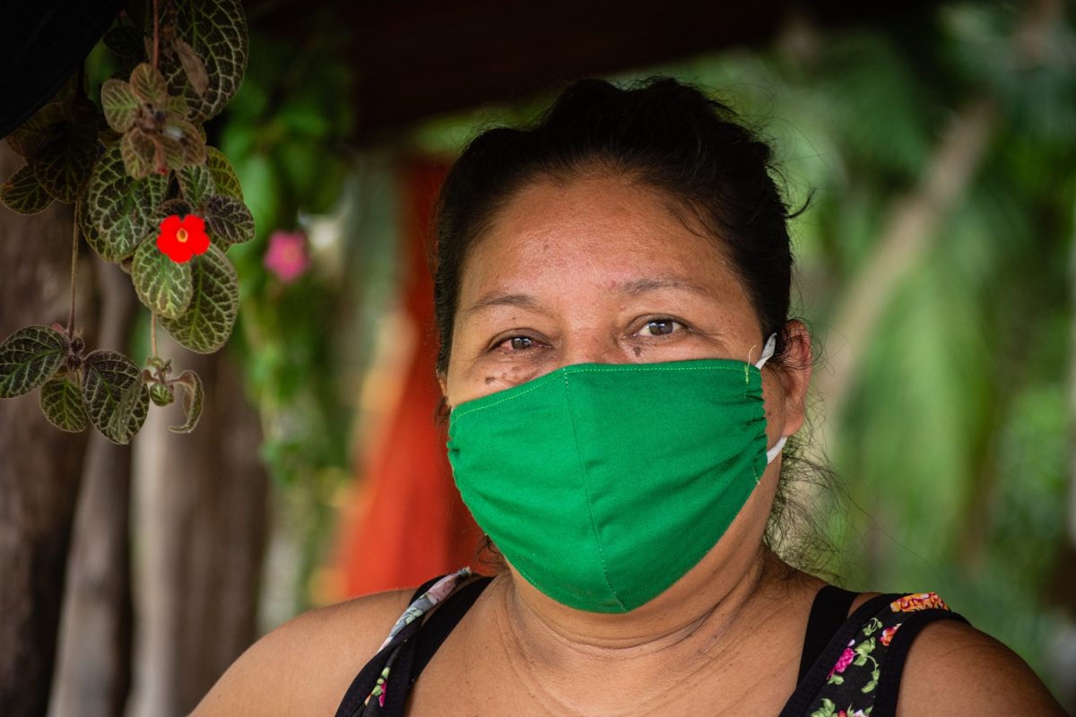 Sandra Amorim wears a green cloth face mask.