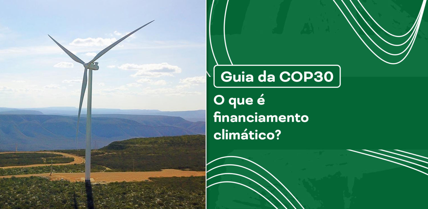 Duas turbinas eólicas (aerogeradores) em um parque eólico, representando projetos de energia mais limpa que demandam financiamento climático.