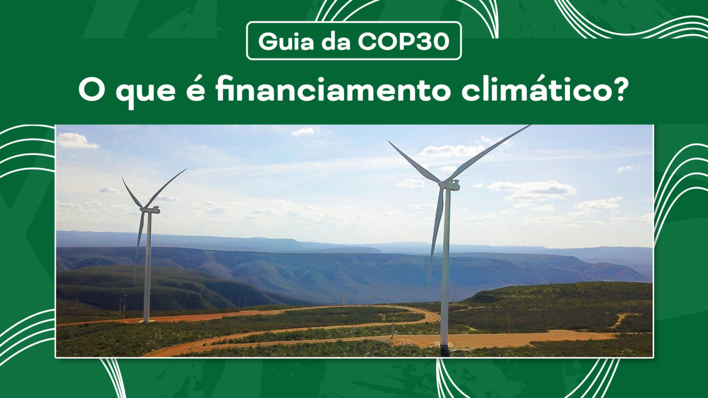 Duas turbinas eólicas (aerogeradores) em um parque eólico, representando projetos de energia mais limpa que demandam financiamento climático.