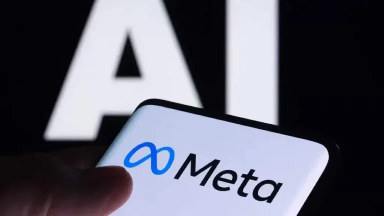 Foto colorida que mostra um celular com tela branca e logo da Meta, com fundo preto onde aparece AI escrito em branco